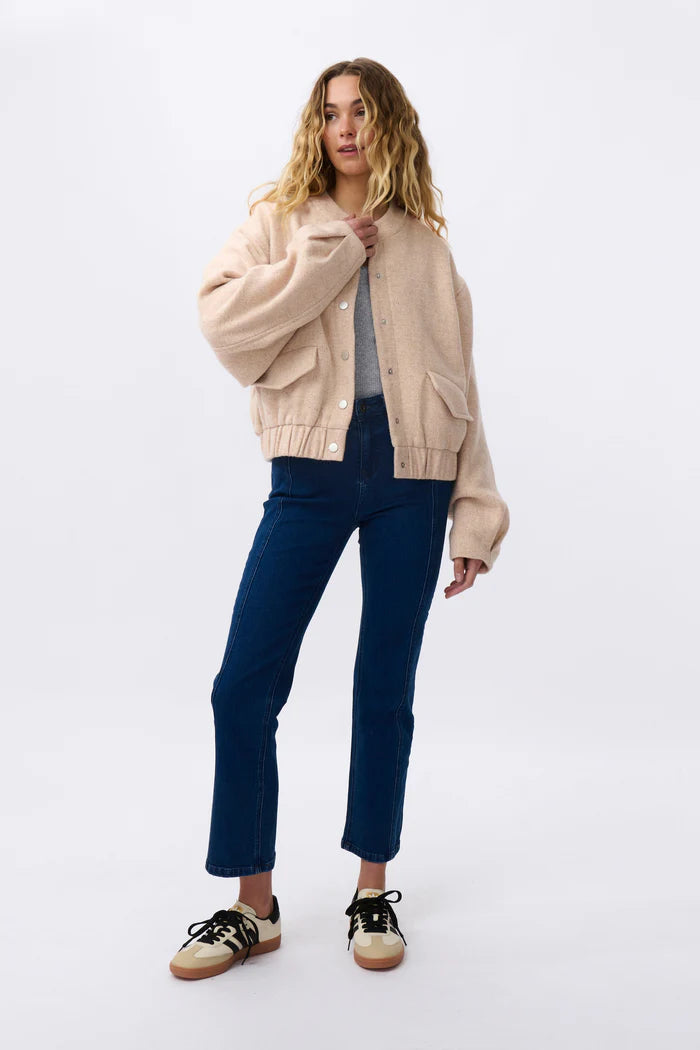 soft pink bomber jacket paired with kireina jeans
