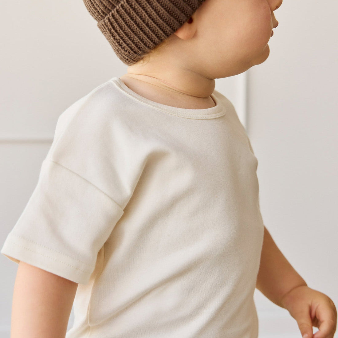 Side view of young boy in the white Pima Cotton Eddie Tee - Cloud | Jamie Kay