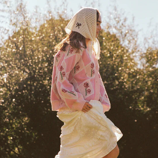 Lady wearing a head scarf and wearing the Rosie Cardigan by JUNI