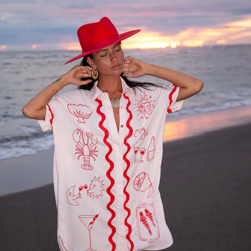 pale pink tshirt dress with red details by Palm Collective