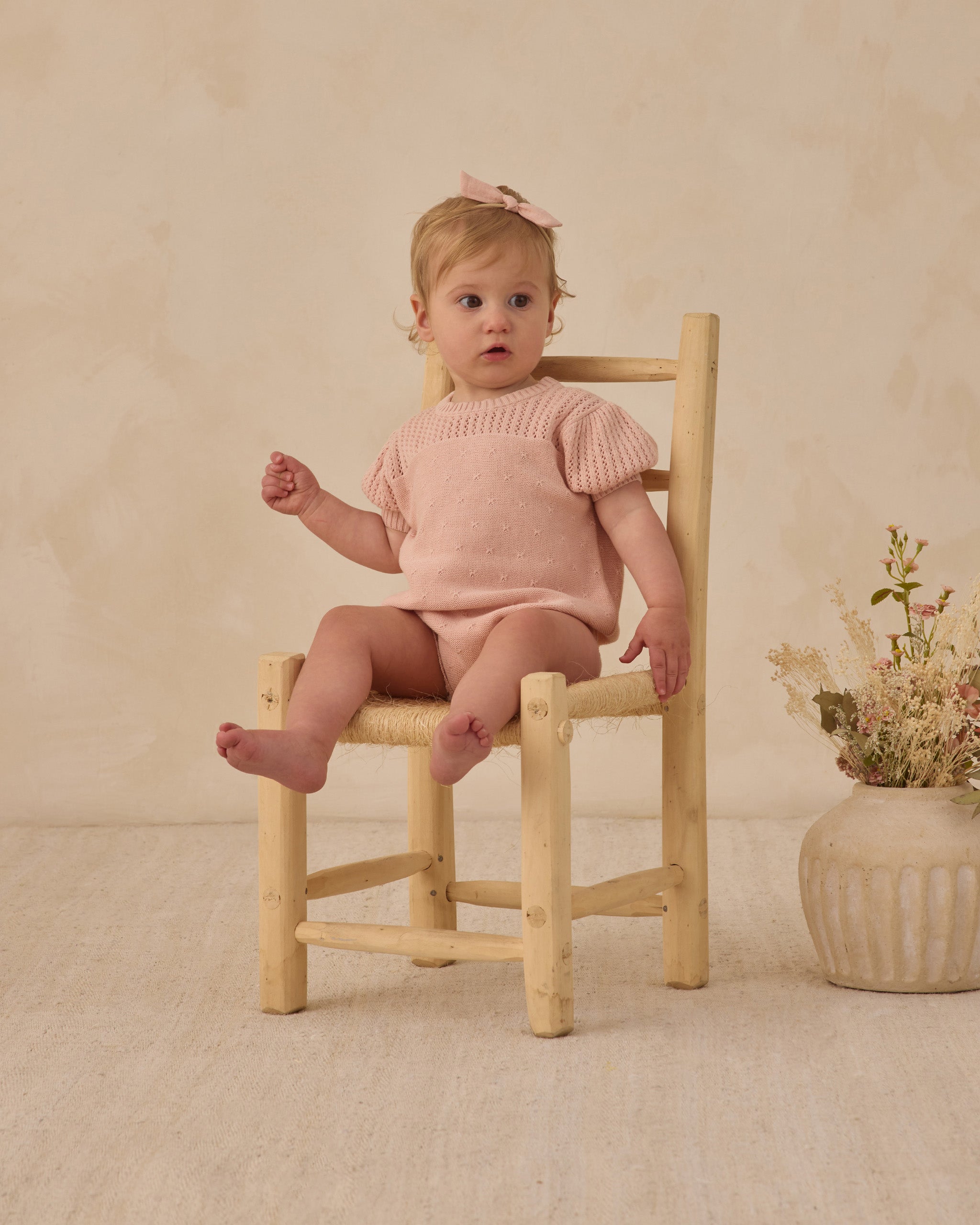 Young girl in the Pointelle Knit Romper Melon | Quincy Mae