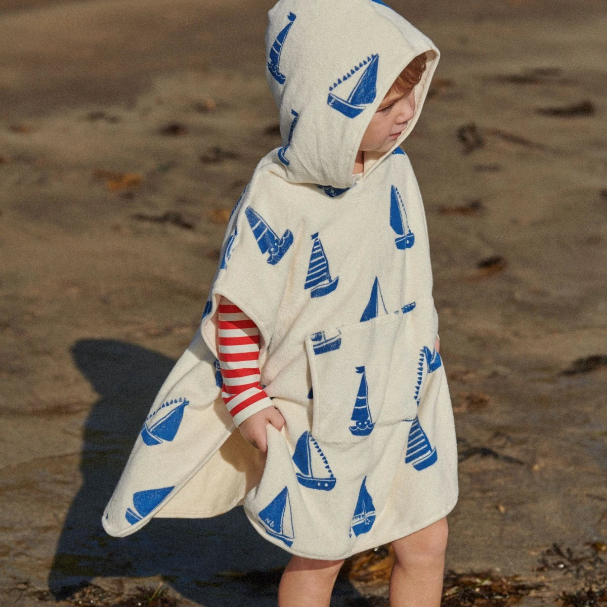Poncho Towel - Regatta Print Terry by Nature Baby: White hooded terry towel for kids with navy boat print