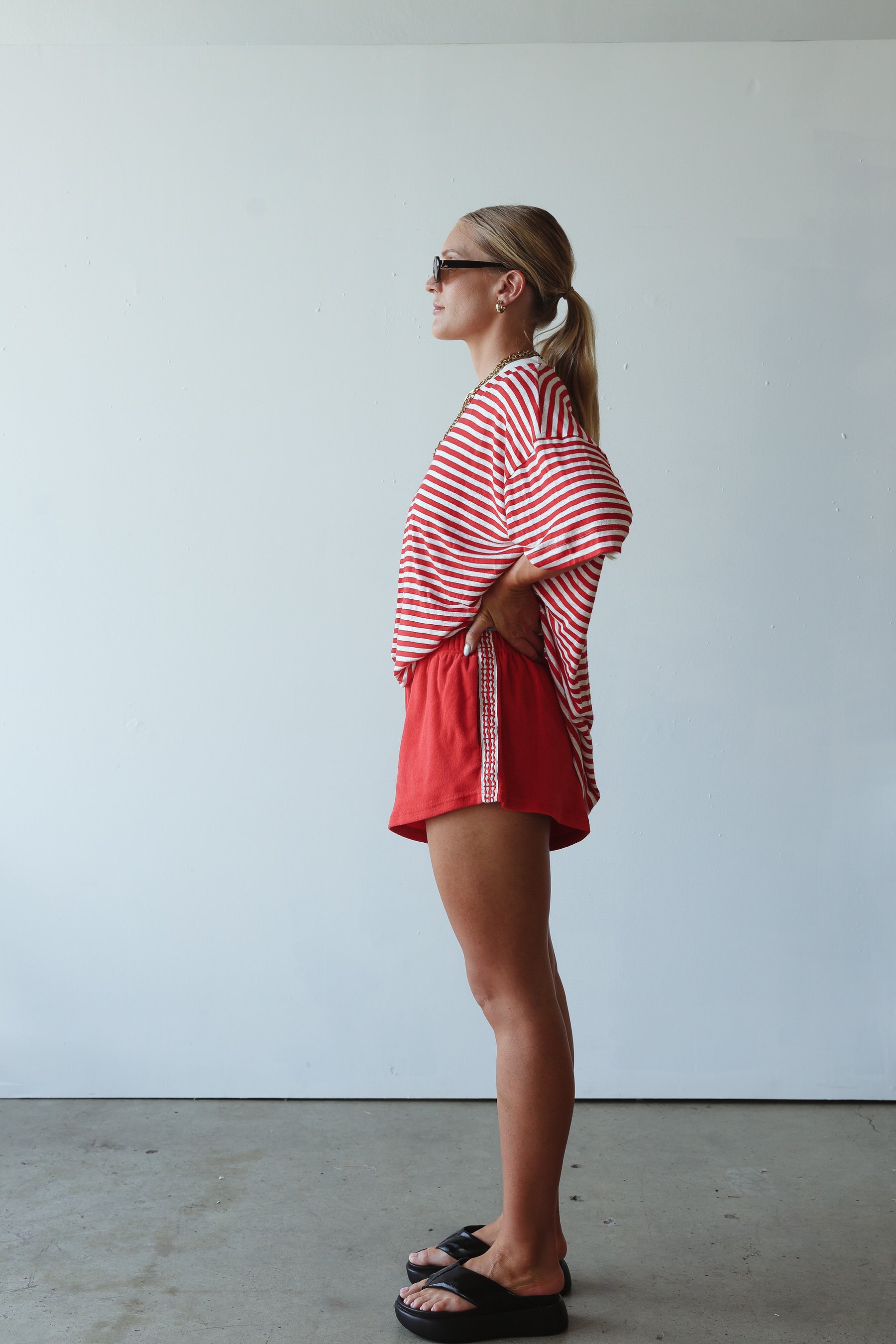 side view of model wearing Pool Bar Short by By Billie