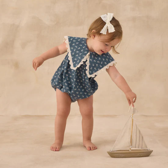 girl wearing Porter Romper Ditsy by Rylee & Cru