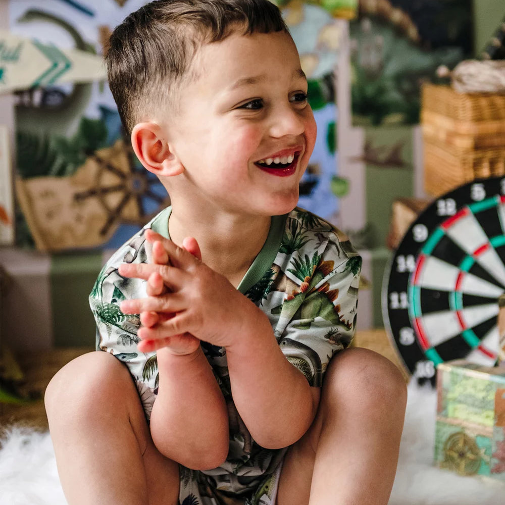 boy wearing 'Prehistorica' Tavi Sleep Set in Olive Leaf | Fleur Harris
