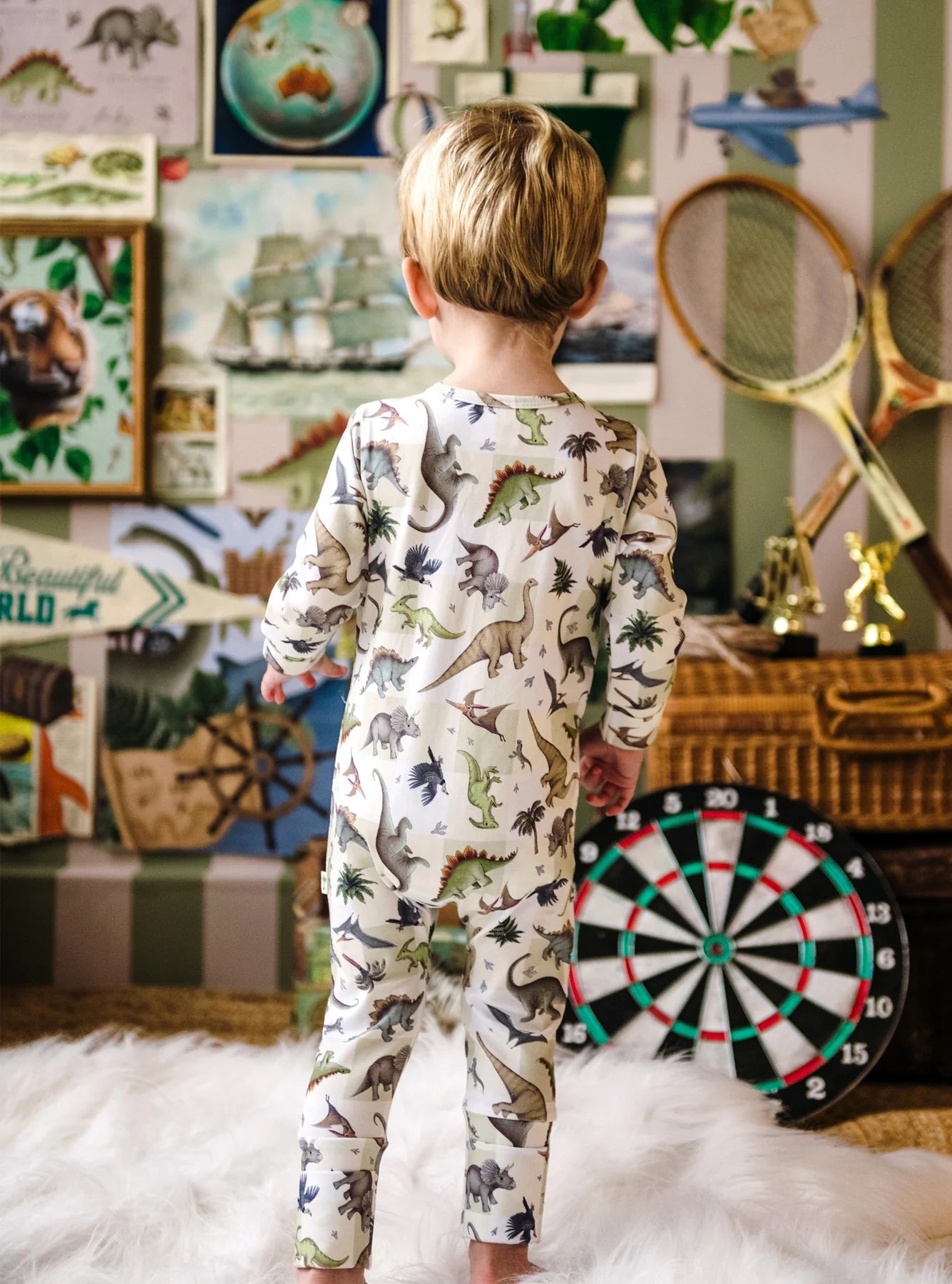 onesie with dinosaurs and green stripes