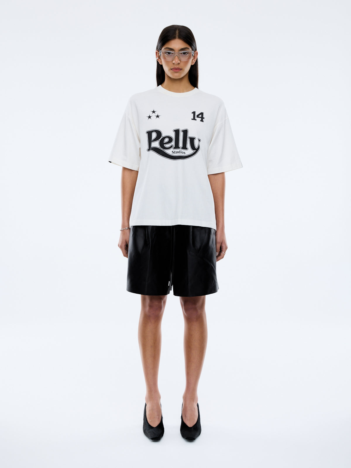model wearing Racing Pelly Swoop tee showing sleeve stripe design and vintage wash cotton fabric texture