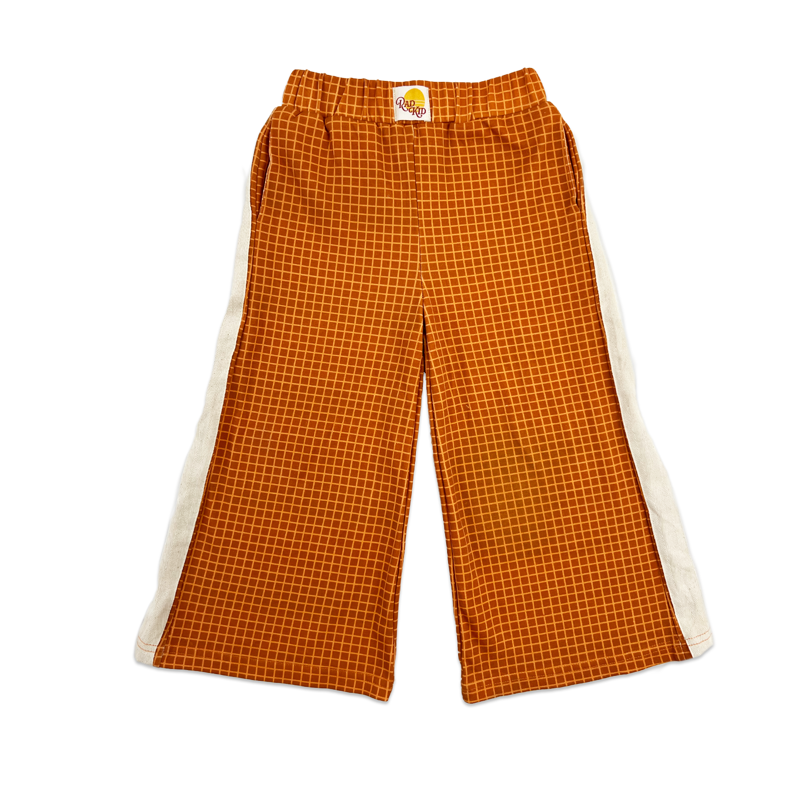 Child wearing Rad Kid pajama set sitting at coffee shop counter with mother