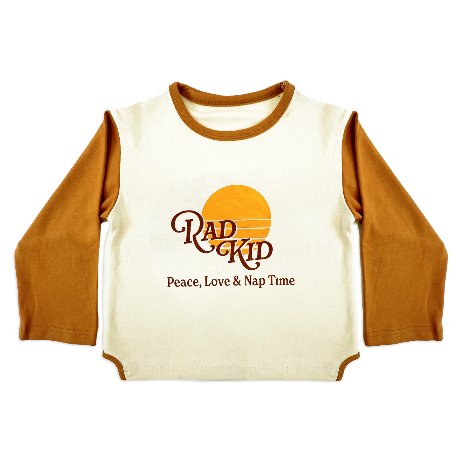 Detail shot of Rad Kid Peace Love Nap Time graphic on cream pajama top with sunset design