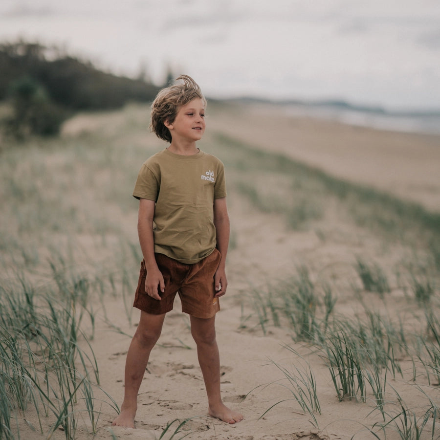 Rad Kid Spliced Cord Shorts by Banabae worn by boy on the beach