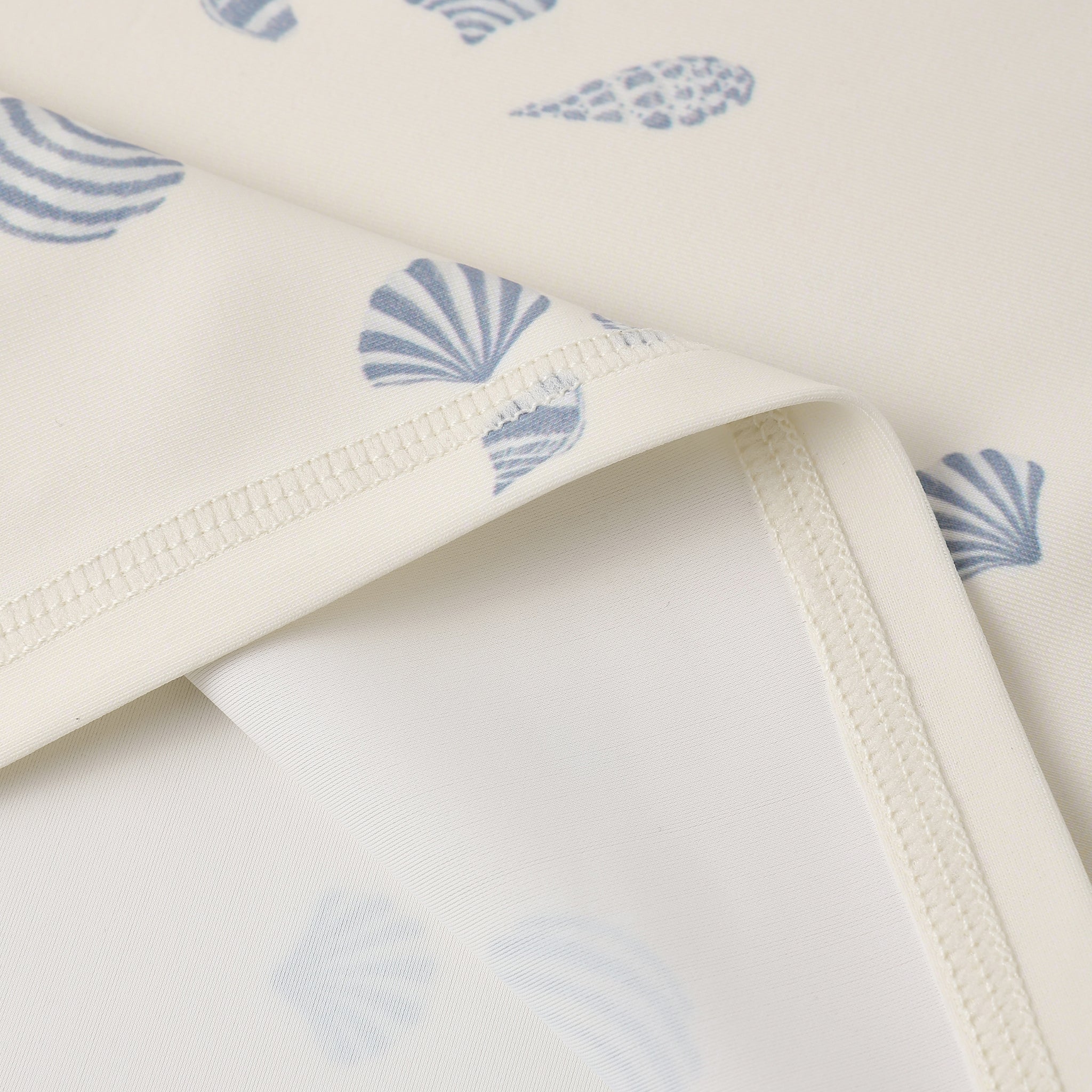 Close up of fabric and print on the Rash guard Girls Set Seashells | Rylee + Cru
