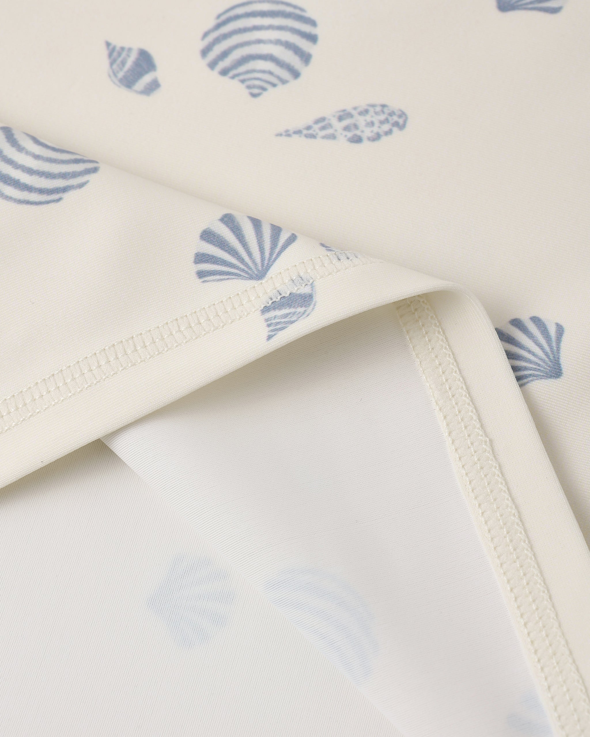 Close up of fabric and print on the Rash guard Girls Set Seashells | Rylee + Cru