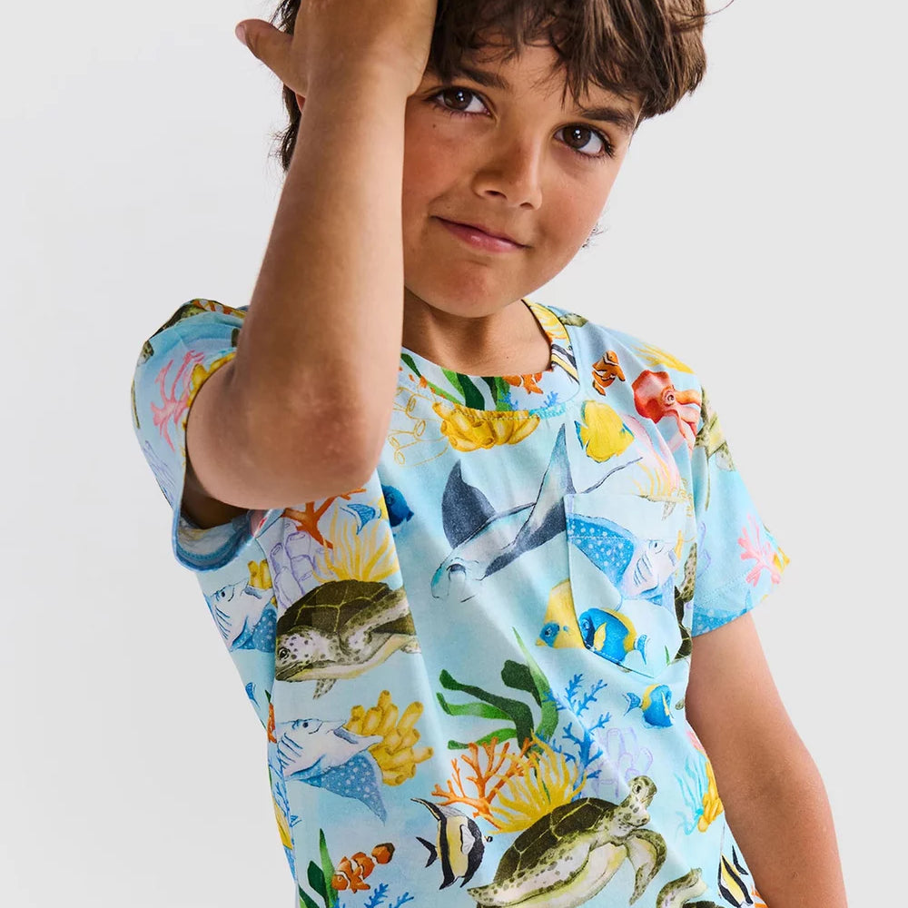 Reef life kids pyjama set by Kip & Co with sea creatures on blue fabric