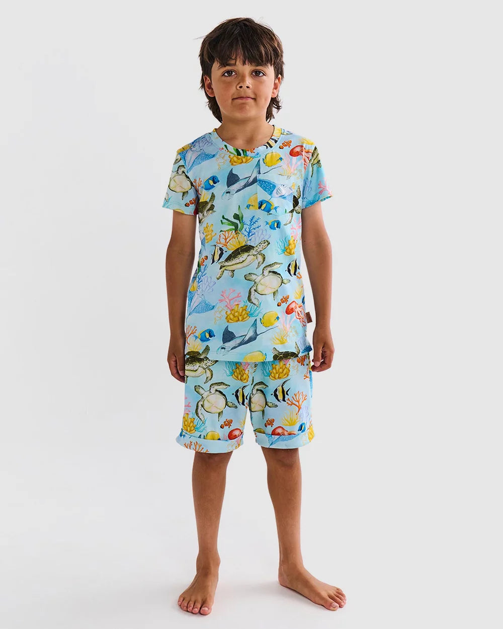 boy wearing Kip & Co Pyjamas - Kip & Co Reef Life Kids Organic Cotton Short Sleeve Tee & Short Pyjama Set