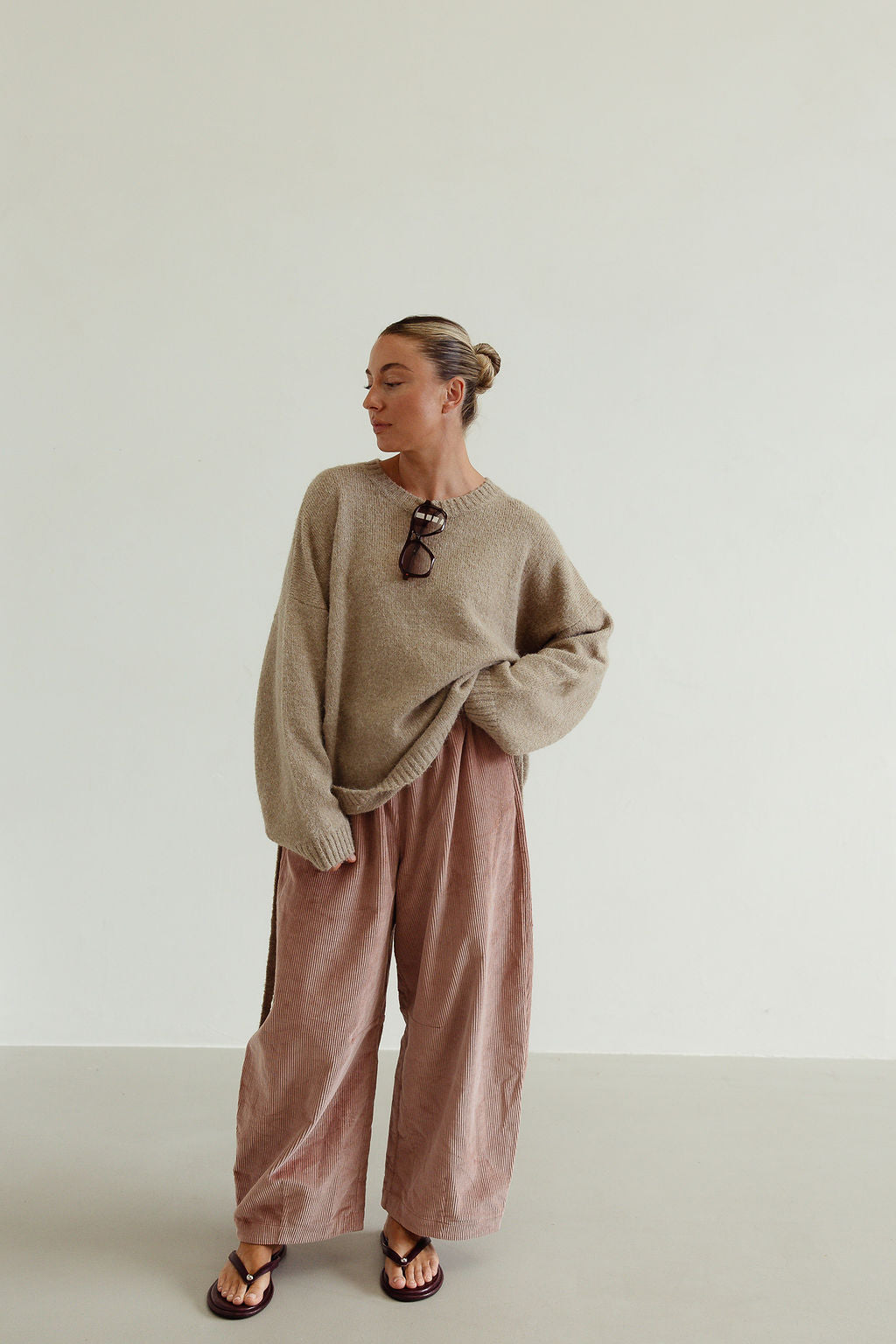 Ren Cord Pant musk pink styled casually with oversized sweater showing relaxed corduroy silhouette