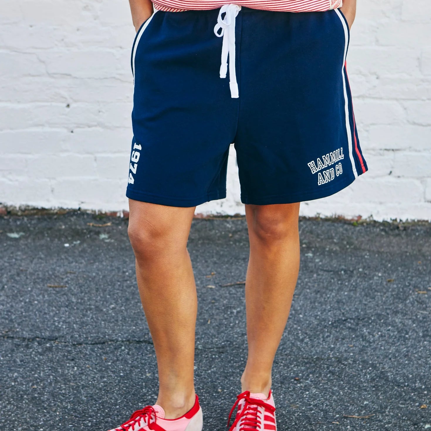 model wearing navy fleece shorts by Hammill & Co