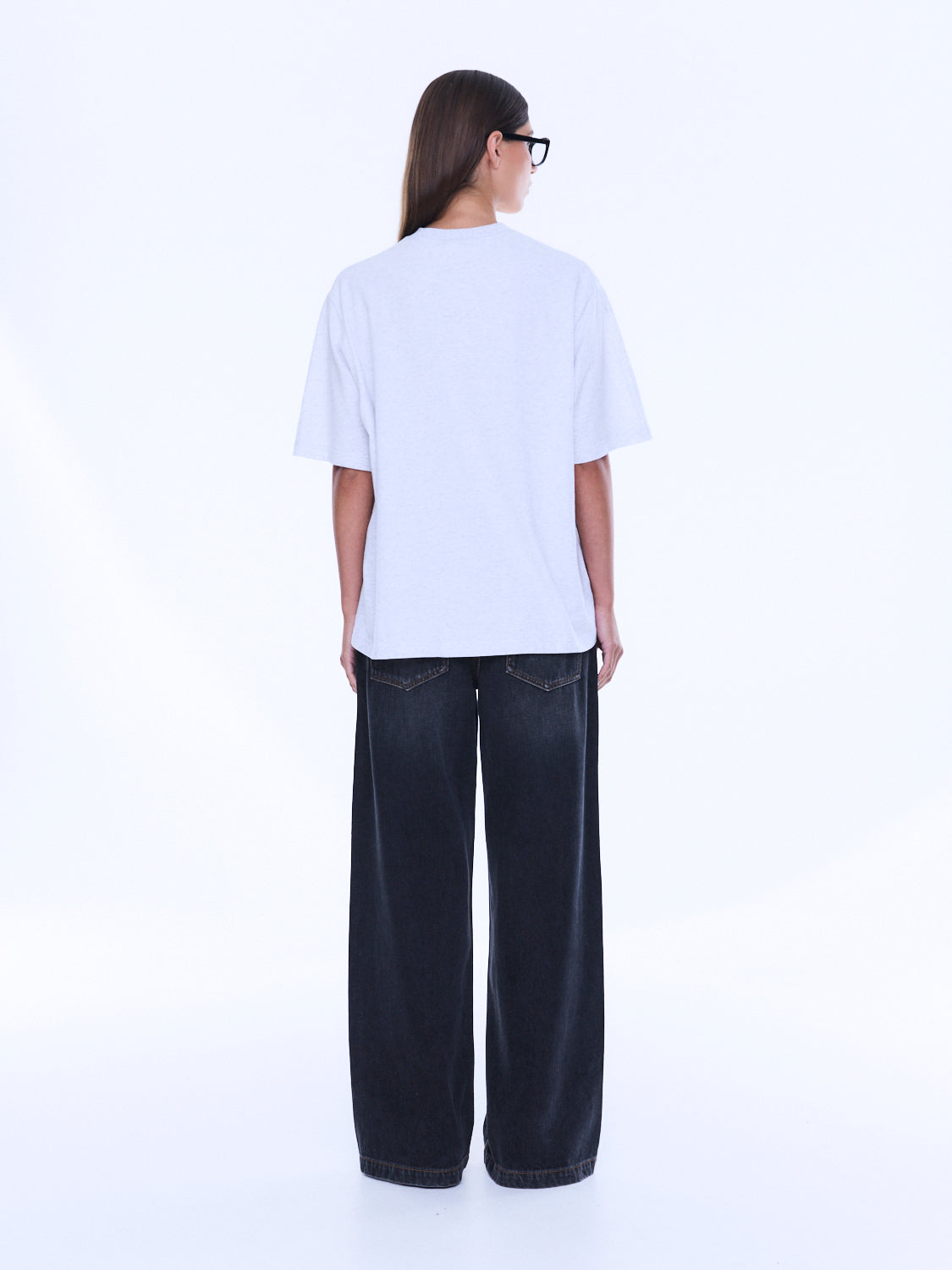 Back view of Sophia Relaxed Tee showing plain white cotton design and relaxed silhouette from behind