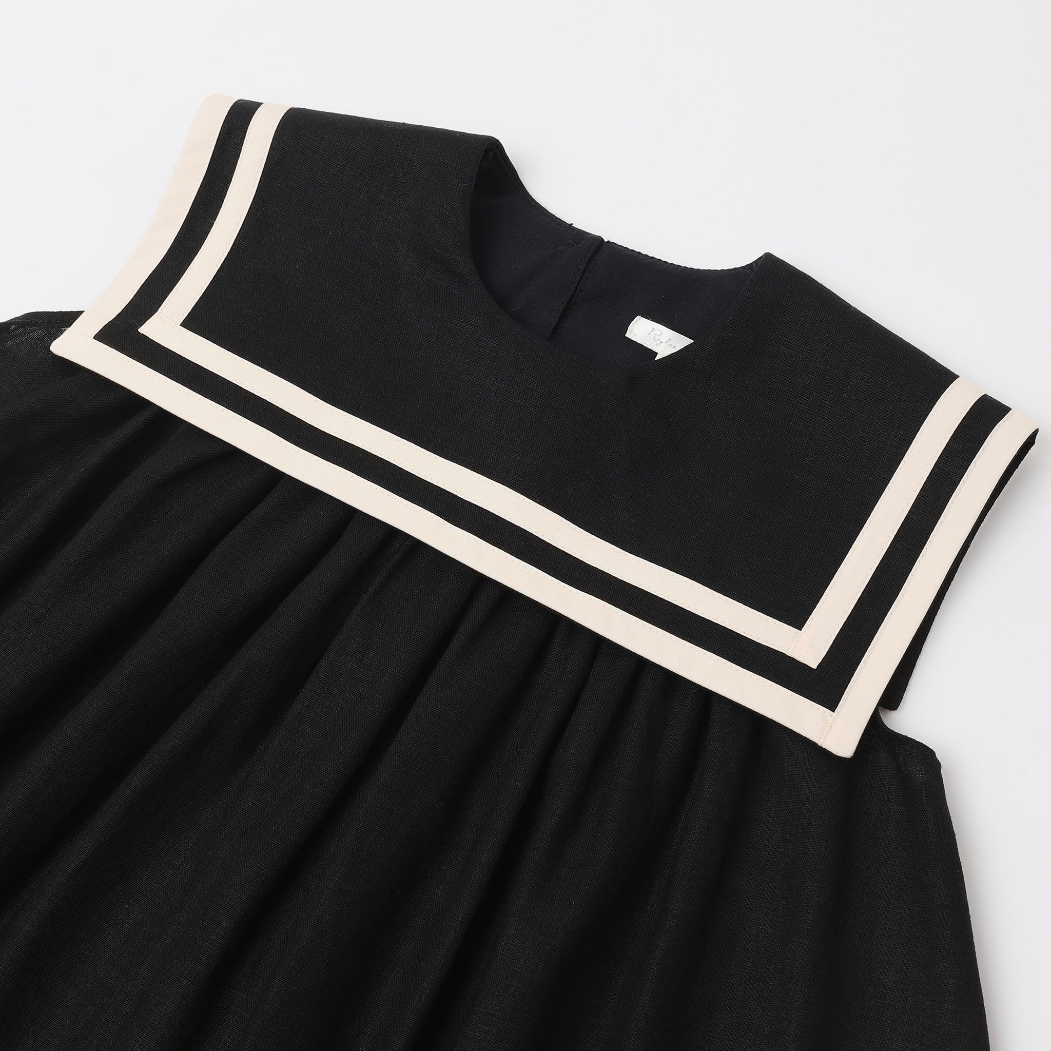 Close up of neckline and fabric on the Sailor Dress Black | Rylee + Cru
