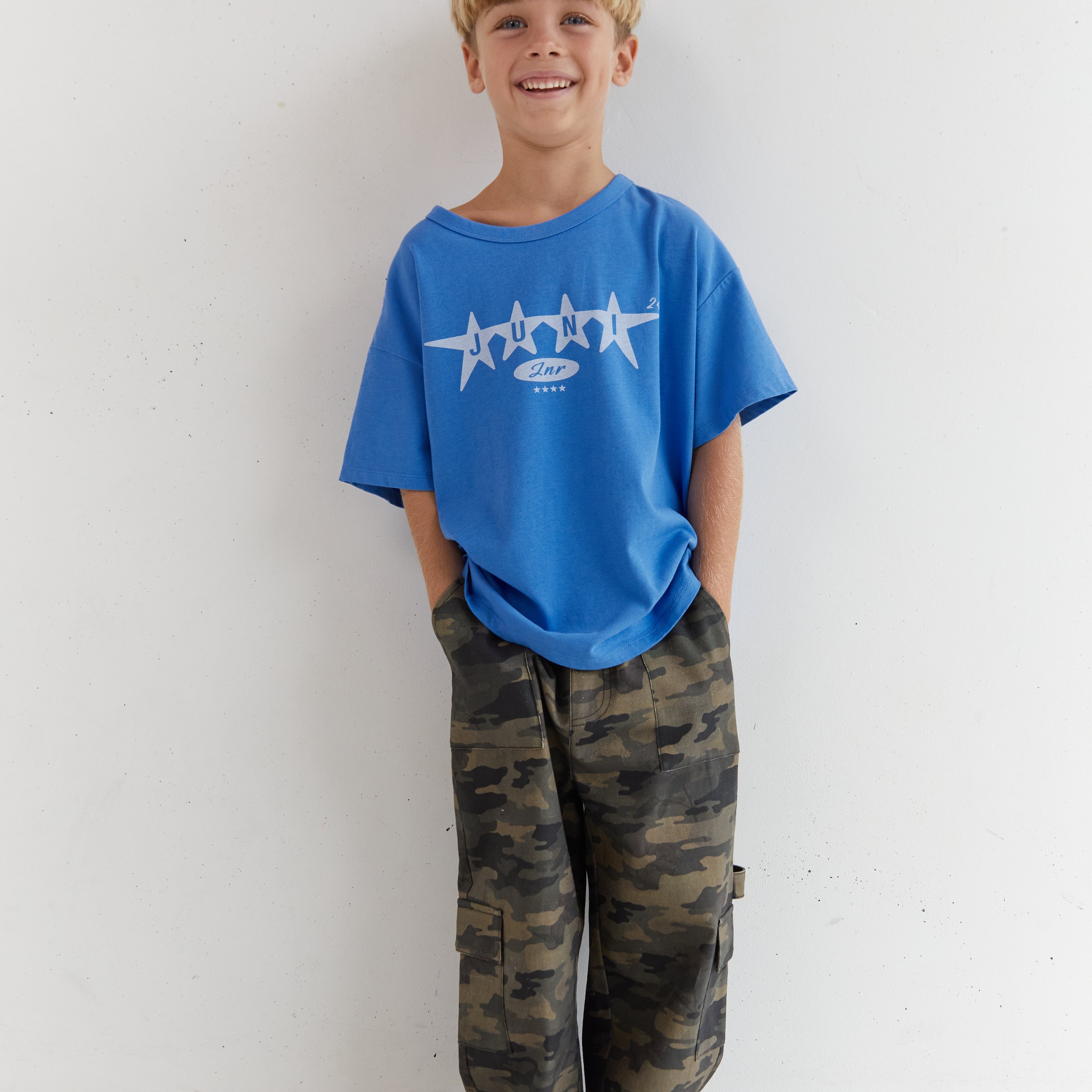 Front view of boy in camo Scottie Pants showing full length relaxed cargo style