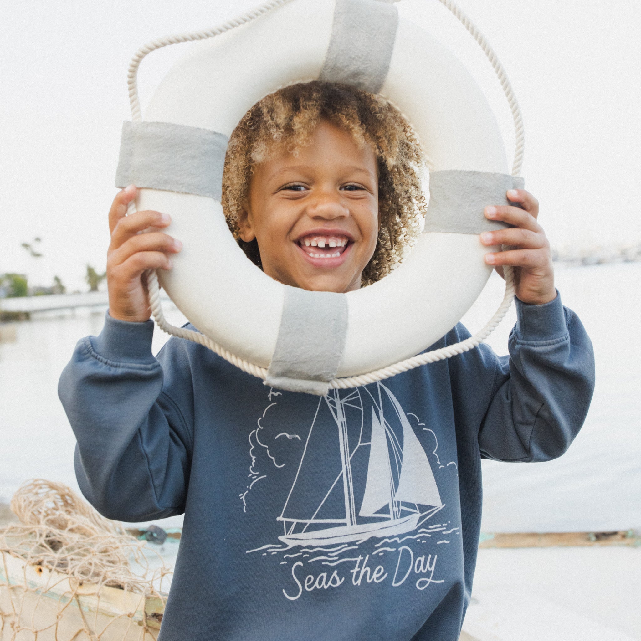 Boy wearing the Seas The Day Sweatshirt | Rylee + Cru