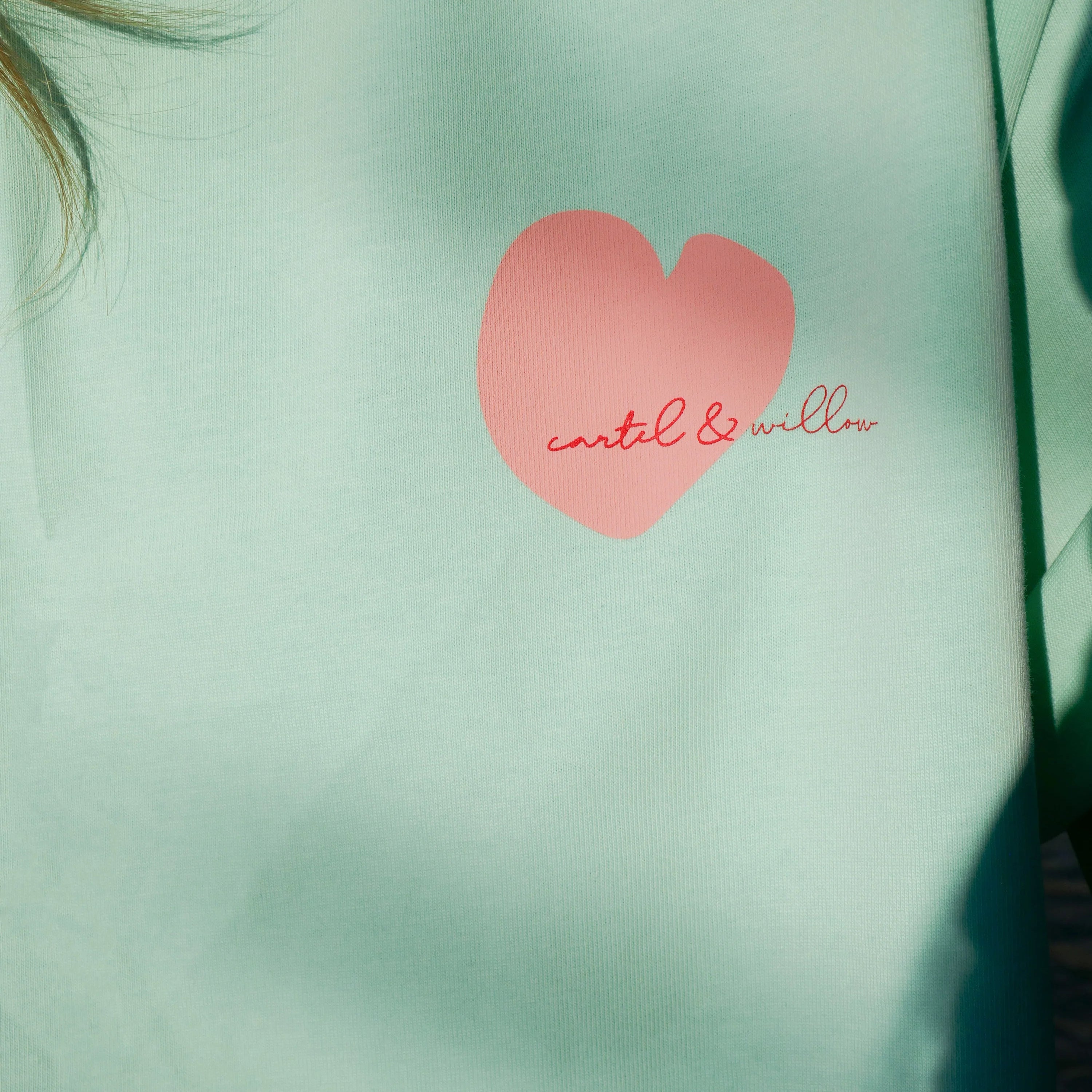 Cartel & Willow Self Love Club tshirt with cute heart logo on front. In colours mint and pink. 100% cotton jersey fabric