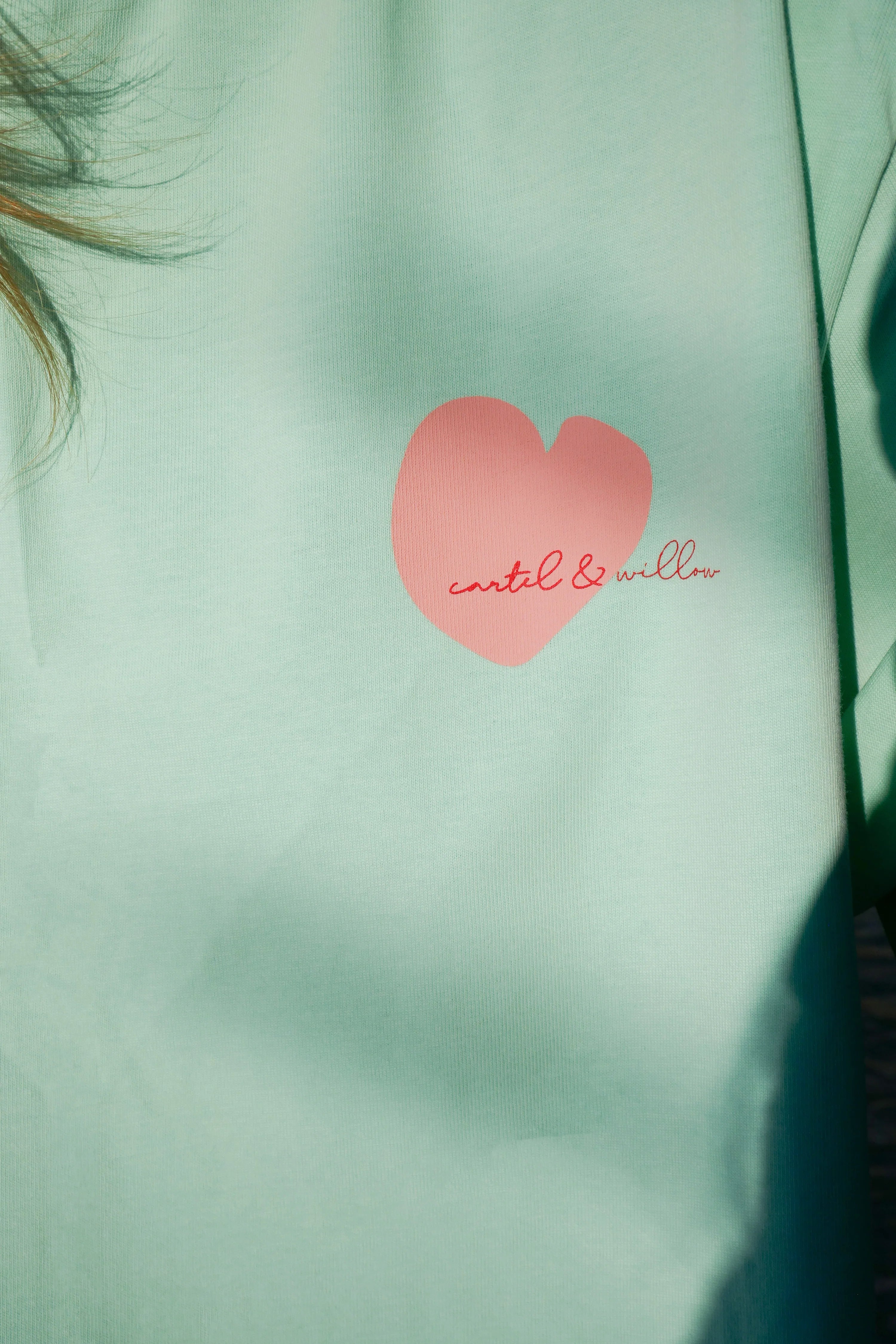 Cartel & Willow Self Love Club tshirt with cute heart logo on front. In colours mint and pink. 100% cotton jersey fabric