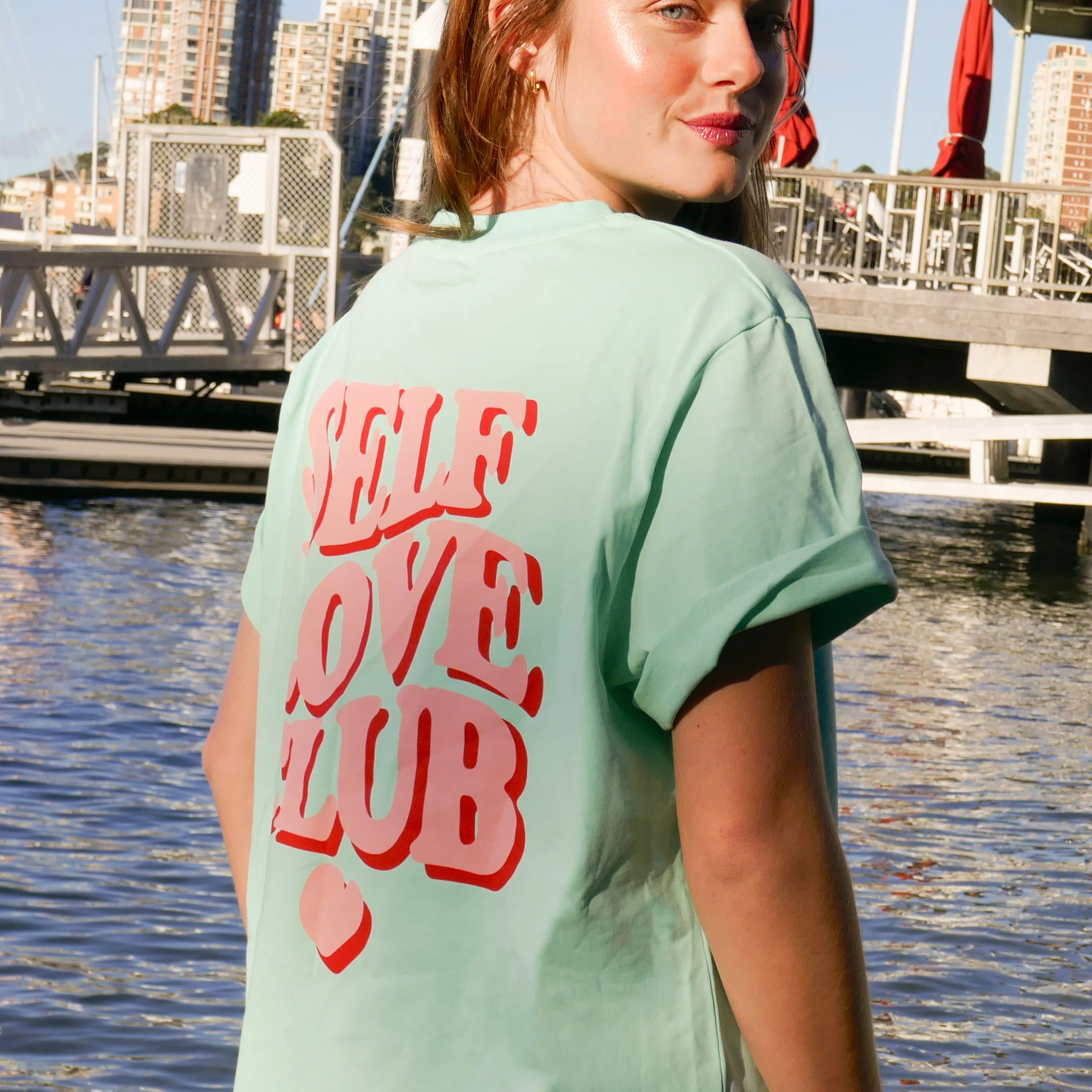 model wearing mint / pink Self Love Club Tshirt by Cartel and Willow