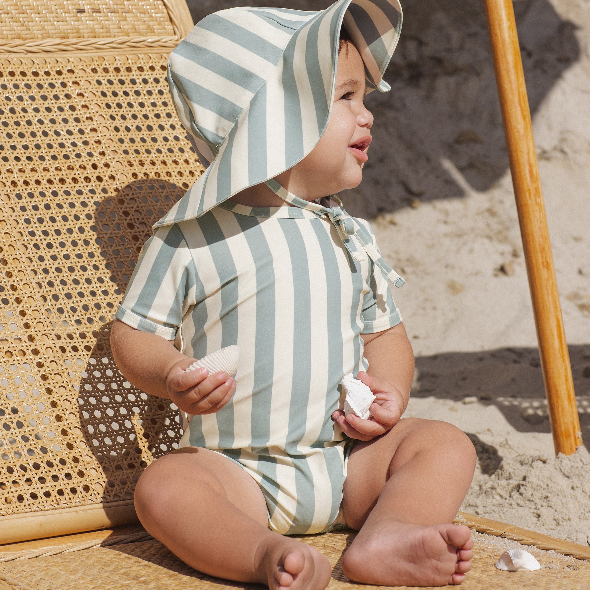 Toddler wearing the Shorty One-Piece Green Stripe | Rylee + Cru
