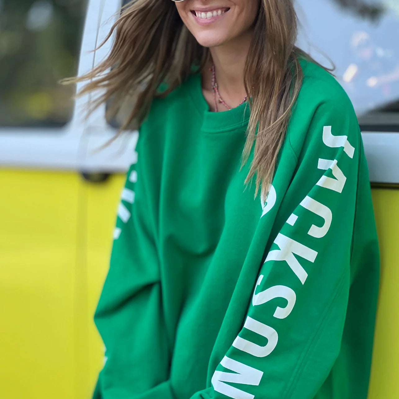 Model wearing Ski oversized stripe cuff jumper green by Hammill & Co