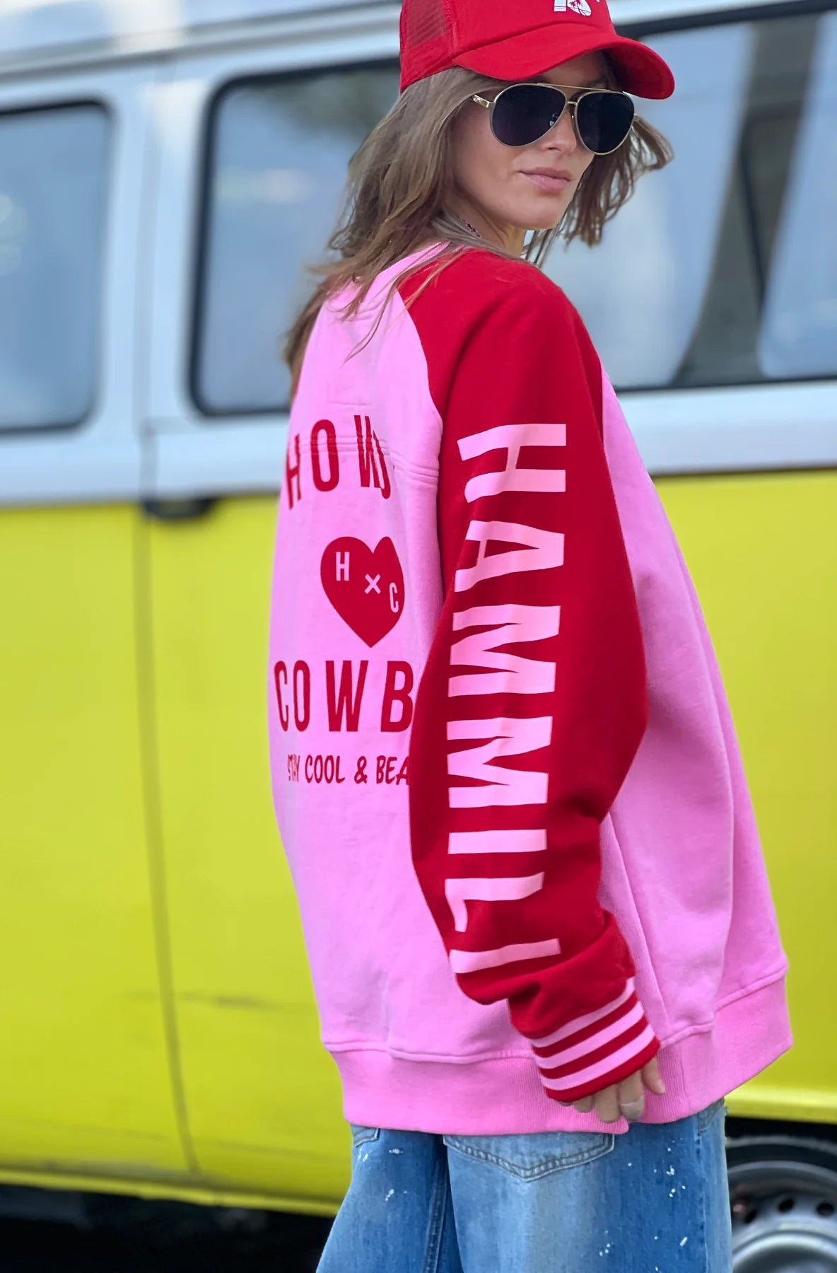 Model wearing Ski oversized stripe cuff sweat pink/red with Hammill & Co on sleeve