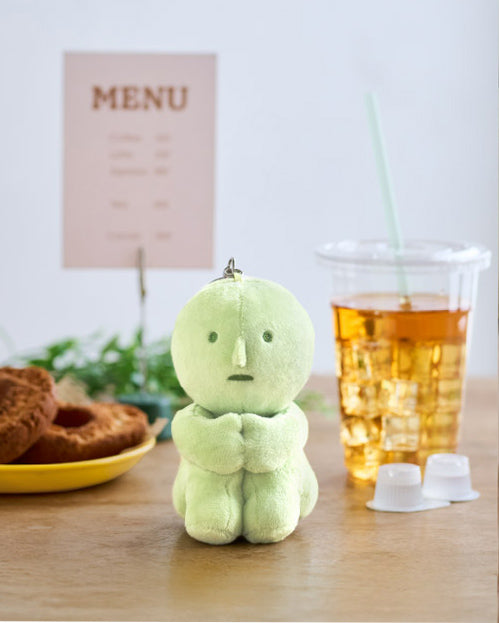 Smiski plush key chain hugging knees