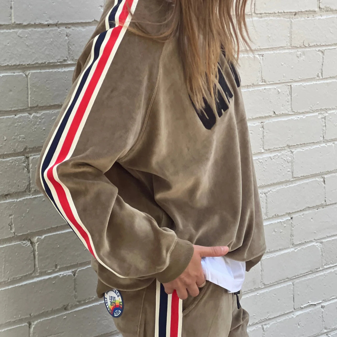 Model wearing game day Khaki sweat by Hammill& Co