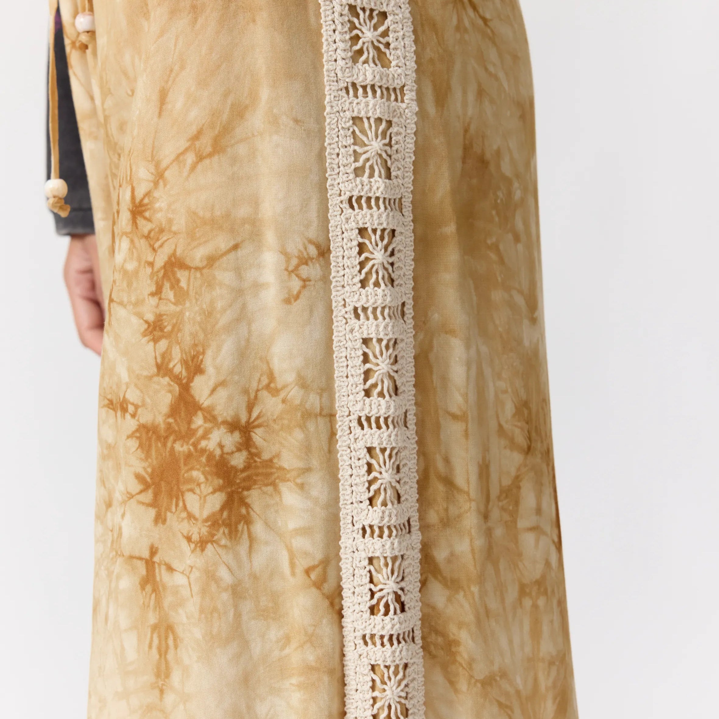 Side view of Sunday Pants displaying cream crochet lace trim detail along outer seam