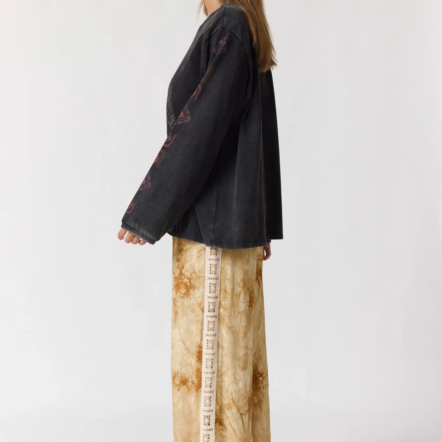 Back view of Sunday Pants showing wide leg silhouette and crochet lace side trim