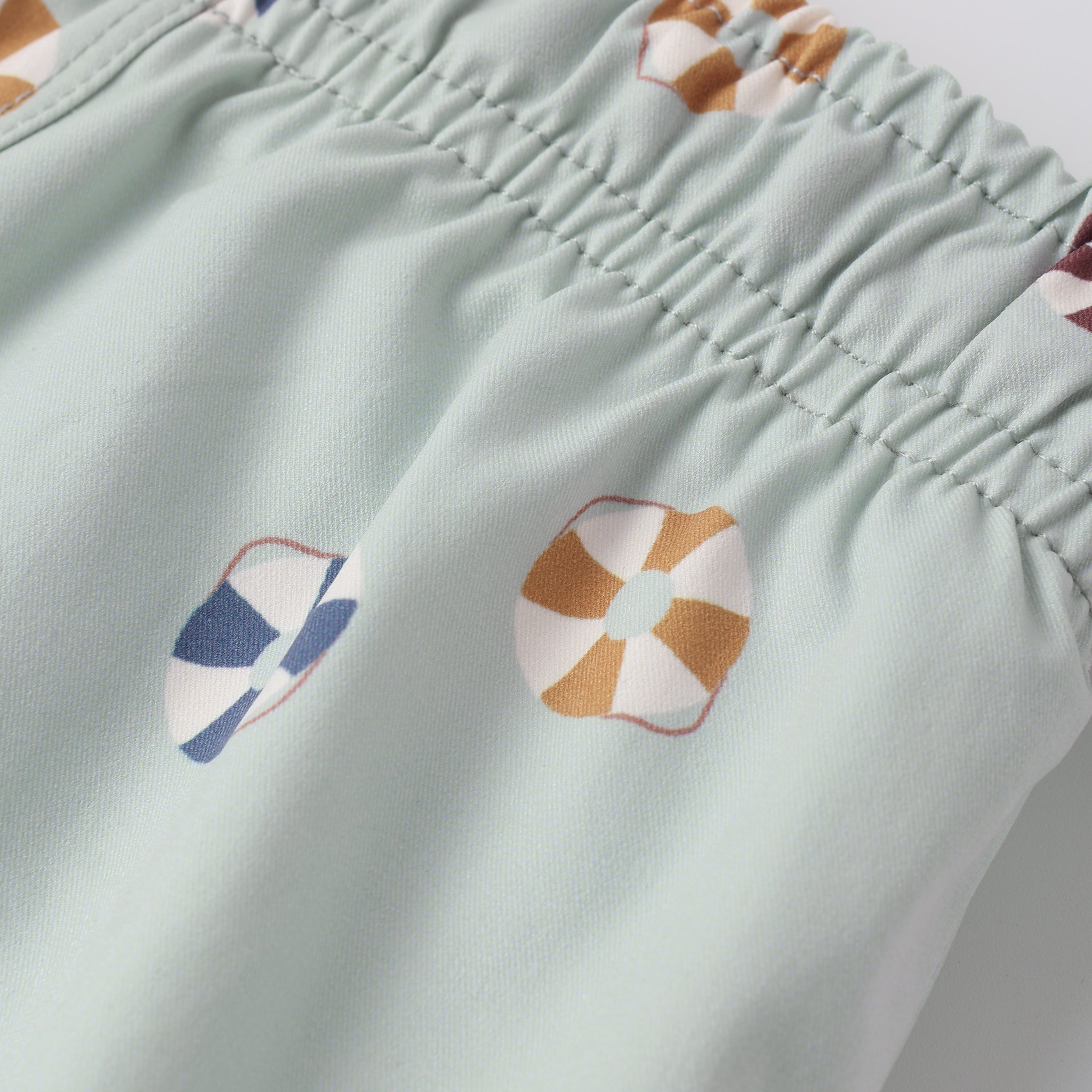 Close up of print and fabric on the Swim Trunk Floatie | Rylee + Cru