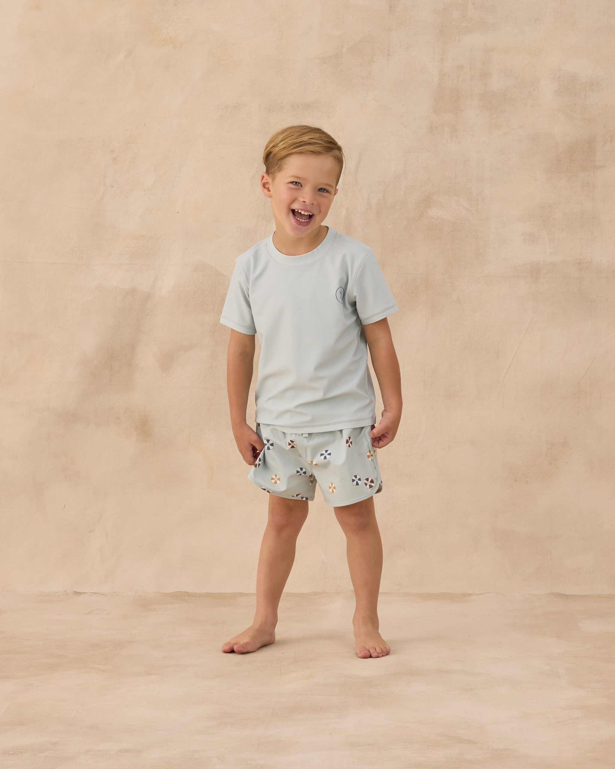 Boy wearing the Swim Trunk Floatie | Rylee + Cru