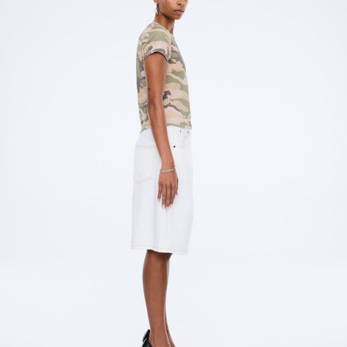 Model wearing Ena Pelly Tessa Baby Tee showing fitted crop silhouette and crew neckline