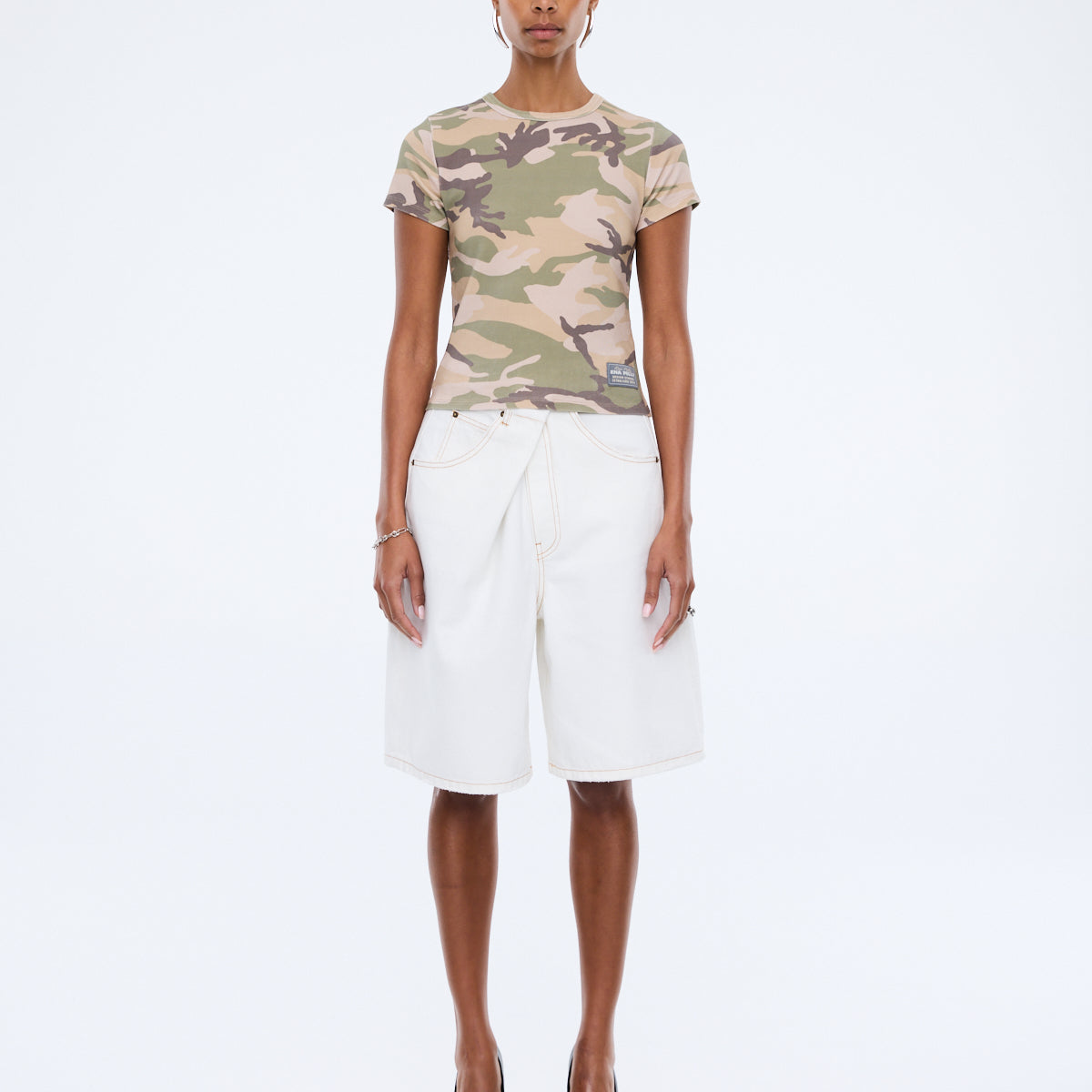 Front view of Ena Pelly Tessa Baby Tee showing cap sleeve design and cropped fit