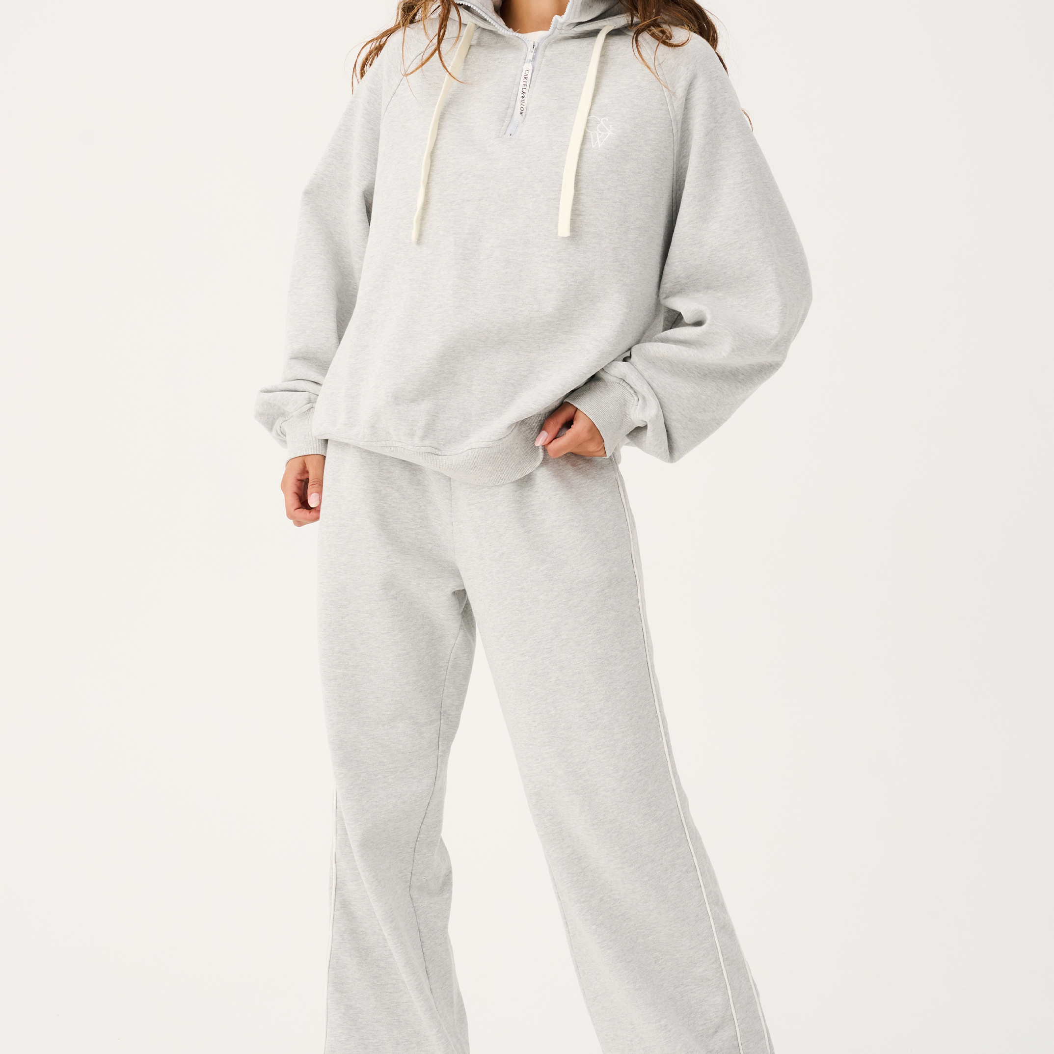 Full body front view of Teagan Hoodie and matching sweatpants in grey marle fabric