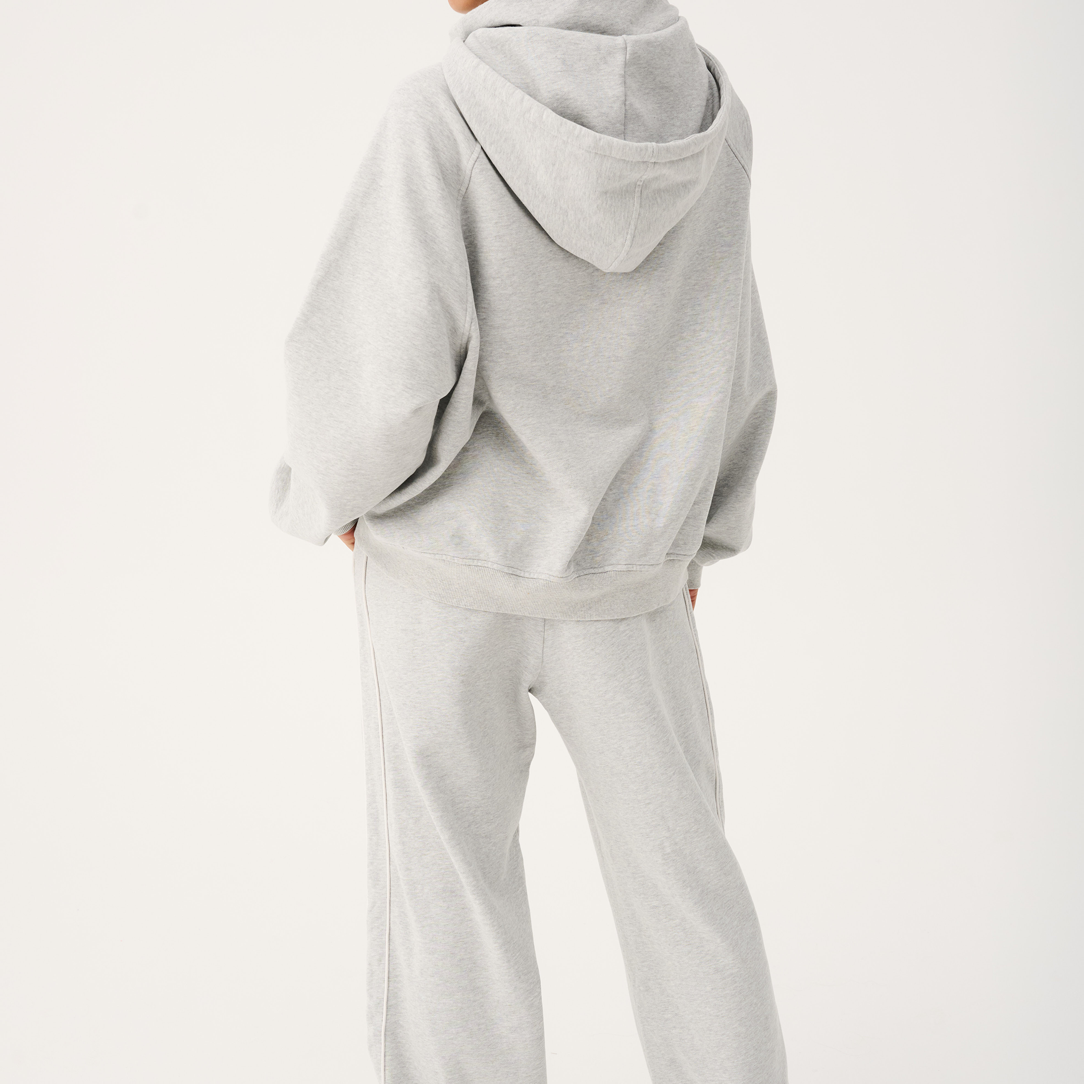 Back view of Teagan Hoodie showing hood construction and oversized fit with matching pants