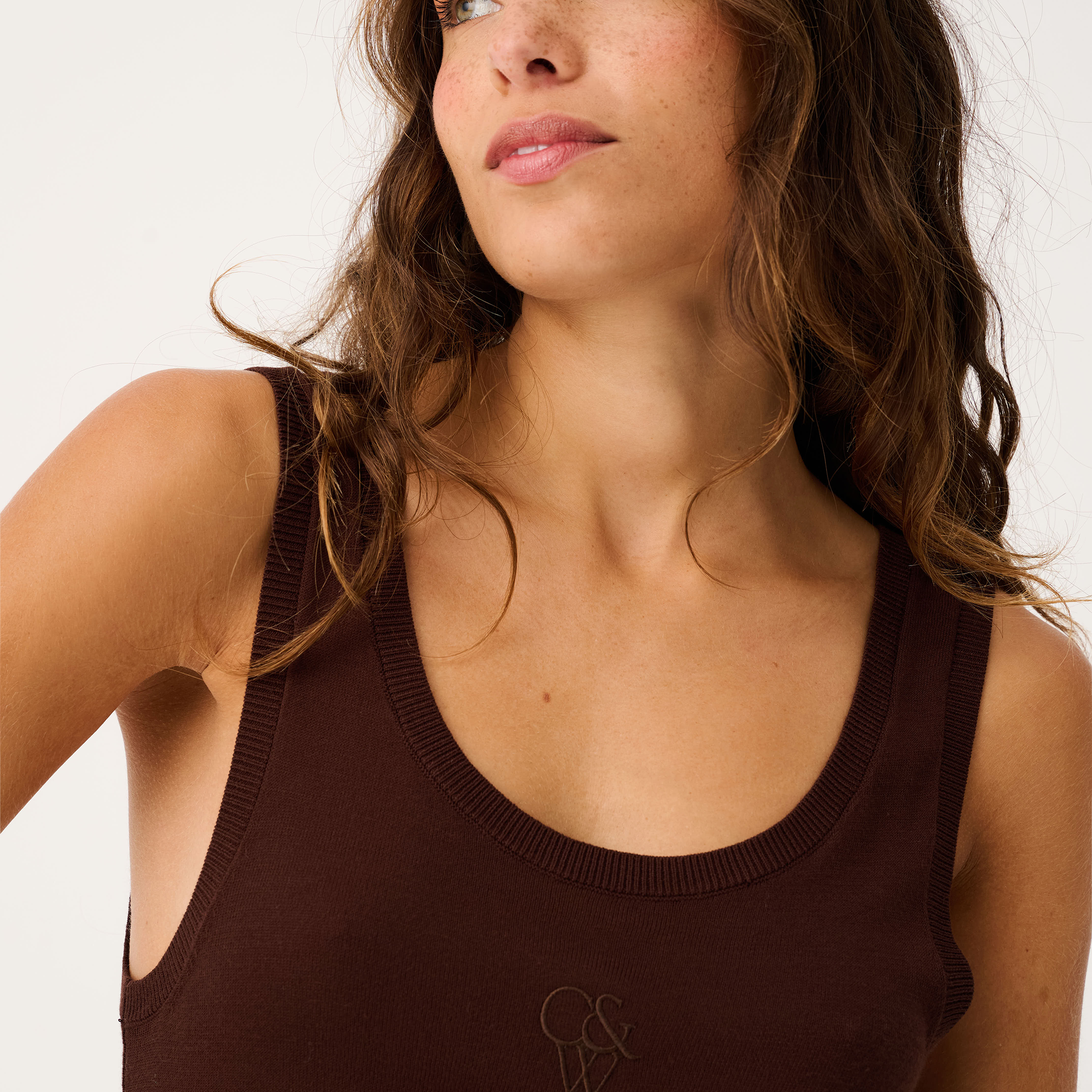 Close-up front angle of Thea Knit Tank in truffle brown with ribbed scoop neck and logo embroidery