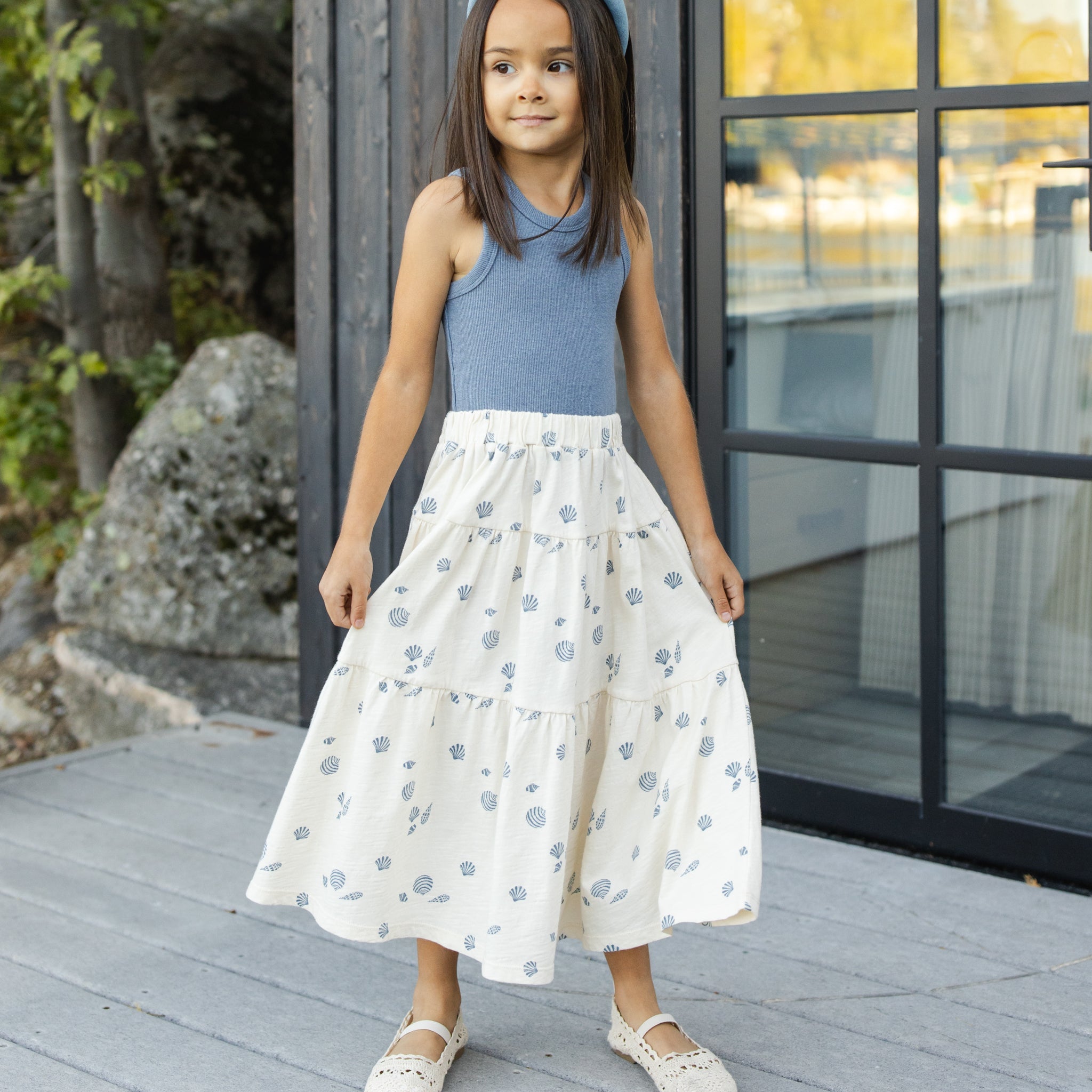 Young girl wearing the Tiered Midi Skirt Seashells | Rylee +Cru