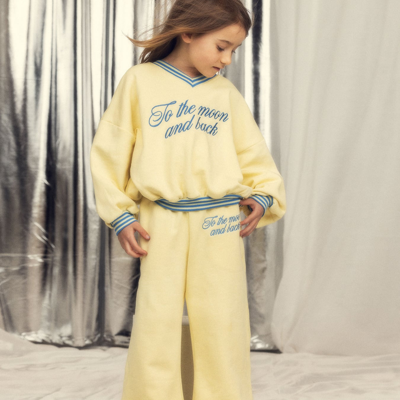 Full outfit styling shot of yellow To the Moon sweatshirt paired with matching yellow pants