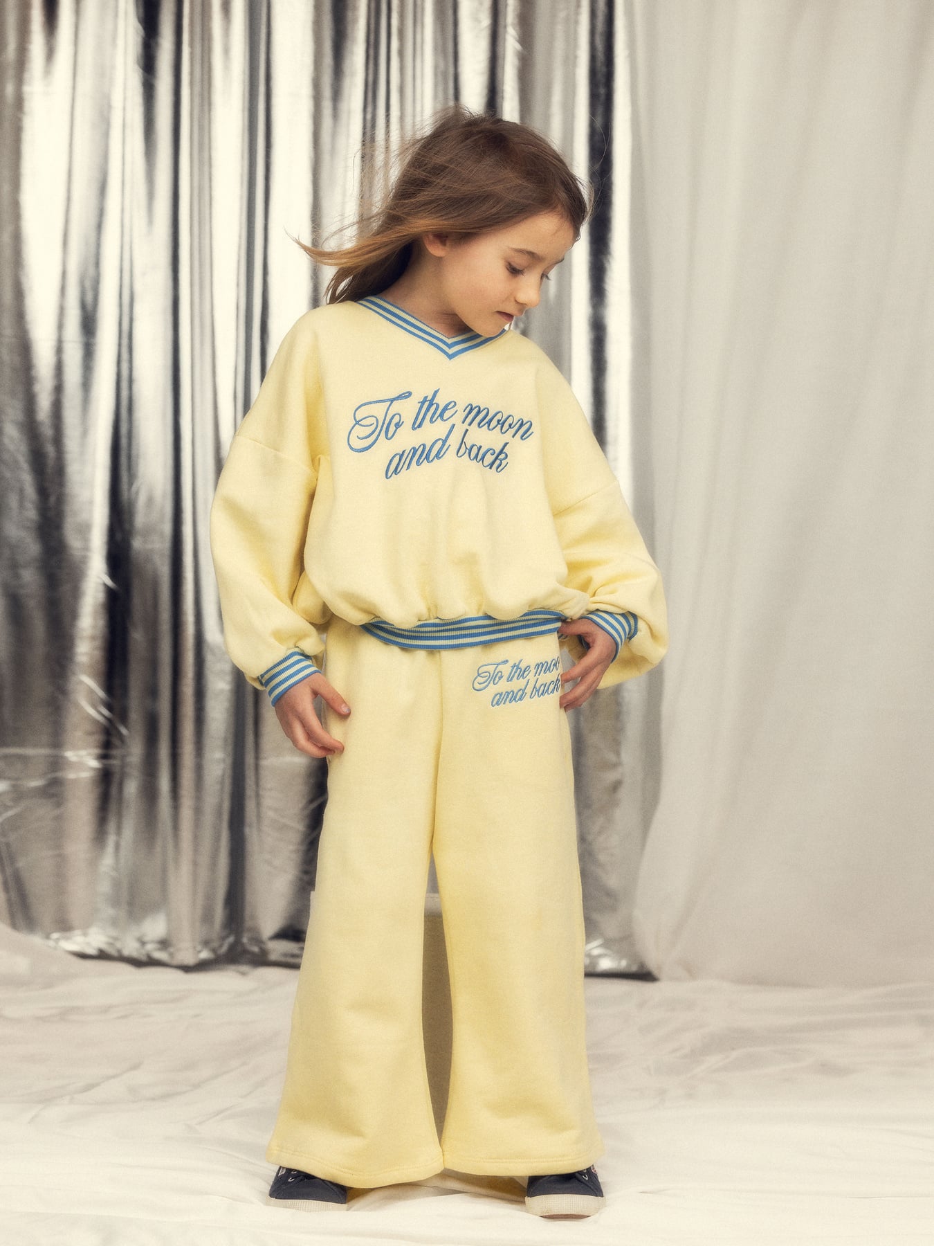 Full outfit styling shot of yellow To the Moon sweatshirt paired with matching yellow pants