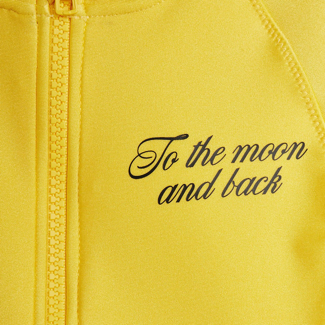 fabric & text detail of To the Moon UV Swimsuit Yellow by Mini Rodini