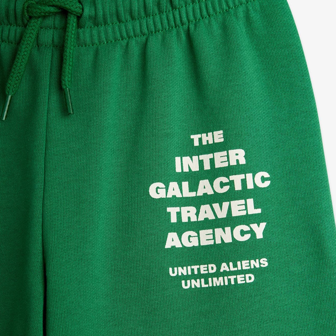 Close up of text on Travel agency sp sweatpants - Green | Mini Rodini