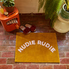 Tula Nudie Rudie Bath Mat - Pear by Sage and Clare - mustard colour organic cotton with peachy pink writing