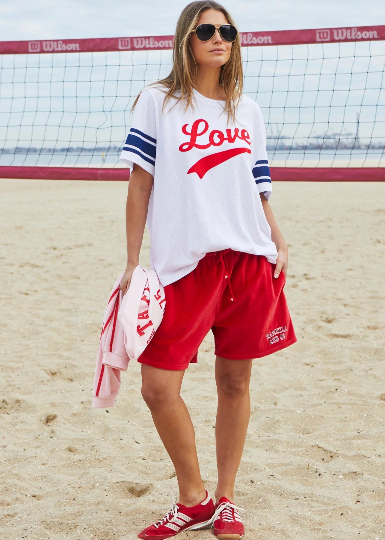white slub cotton tee with red writing "love" on chest and navy stripes on sleeves