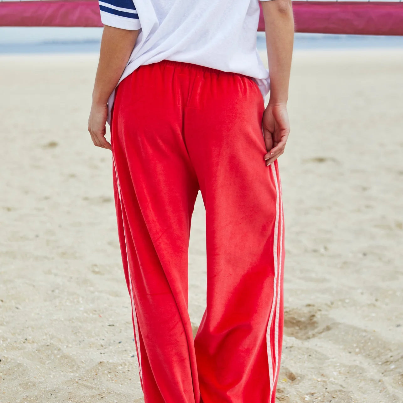 ultra comfortable velour sweat pants by Hammill and co, in red with pink stripes down the side
