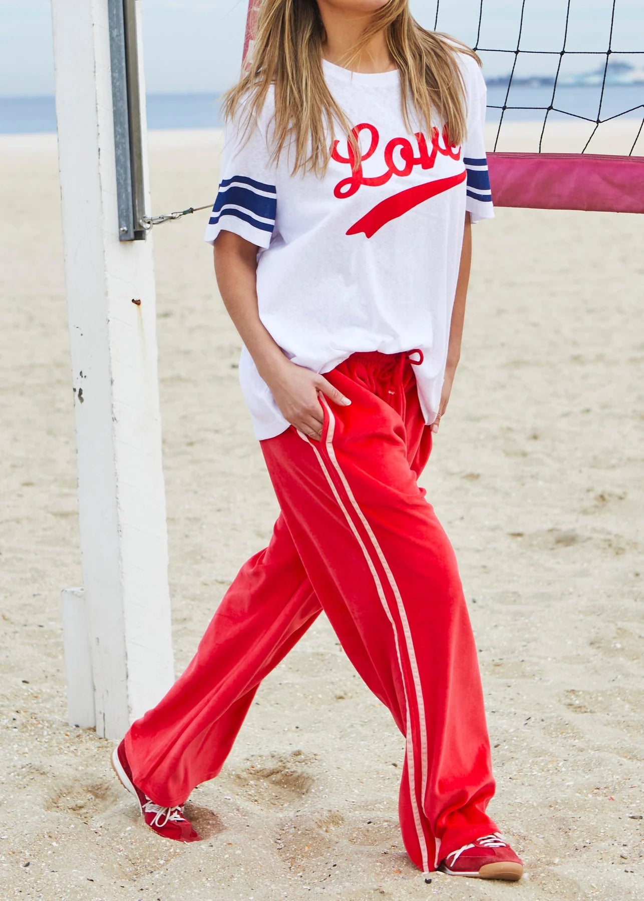 Womens Red velour track pants with pink stripes